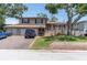 Charming two-story home featuring a brick facade, a two-car garage, and a cozy front porch at 8263 132Nd St, Seminole, FL 33776