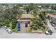 A charming two-story home with a well-manicured front yard and mature trees providing ample shade at 8263 132Nd St, Seminole, FL 33776