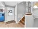 Welcoming foyer with hardwood floors, a decorative staircase, and a stylish front door at 8263 132Nd St, Seminole, FL 33776
