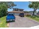 Charming two-story home with a well-maintained front yard, two-car garage, and welcoming front porch at 8263 132Nd St, Seminole, FL 33776