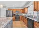 Updated kitchen with granite counters, stainless steel appliances and stylish backsplash at 8263 132Nd St, Seminole, FL 33776