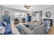 Bright and airy living room featuring comfortable seating, hardwood floors, and an open view to the front yard at 8263 132Nd St, Seminole, FL 33776