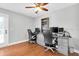 Office with hardwood floors, ceiling fan, and desk setup at 8263 132Nd St, Seminole, FL 33776
