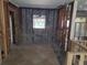 Partially remodeled room showcasing updated tile floors and exposed block and wood framing at 860 Bruce Ave, Clearwater Beach, FL 33767