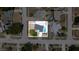 An aerial view of the property showcasing the home, the pool, and the spacious backyard at 9097 Southern Comfort Dr, Largo, FL 33773