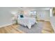 Cozy bedroom with neutral decor, wood flooring, and natural light, creating a relaxing atmosphere at 9097 Southern Comfort Dr, Largo, FL 33773