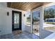 Charming front porch with decorative tile flooring and stylish decor at 9097 Southern Comfort Dr, Largo, FL 33773