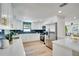 Stylish kitchen showcasing white cabinets, stainless steel appliances, and light countertops at 9097 Southern Comfort Dr, Largo, FL 33773