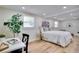 Bright bedroom with wood floors, large plant, work space and large window with blinds at 9097 Southern Comfort Dr, Largo, FL 33773