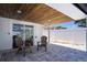 Covered outdoor patio with wood ceiling, ideal for relaxing or entertaining guests in style at 9097 Southern Comfort Dr, Largo, FL 33773