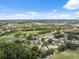 Aerial view showcasing the community's homes, green spaces, and nearby amenities including a golf course at 9307 Golf View Dr, New Port Richey, FL 34655