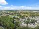 Aerial view showcasing the golf course and community with lush landscaping and water features at 9307 Golf View Dr, New Port Richey, FL 34655