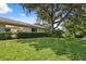 Well-manicured lawn and landscaping enhance the exterior of this home at 9307 Golf View Dr, New Port Richey, FL 34655