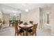 Cozy dining area features a round table, comfortable chairs, and a mirrored wall at 9307 Golf View Dr, New Port Richey, FL 34655