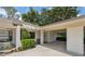 Charming home exterior featuring a covered carport and well-maintained landscaping at 9307 Golf View Dr, New Port Richey, FL 34655