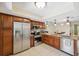 Modern kitchen featuring stainless steel appliances, tile floors and granite countertops at 9307 Golf View Dr, New Port Richey, FL 34655