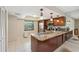 Kitchen island with stainless steel appliances and granite countertops at 9307 Golf View Dr, New Port Richey, FL 34655