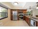 Modern kitchen featuring stainless steel appliances, tile floors and granite countertops at 9307 Golf View Dr, New Port Richey, FL 34655