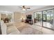 Inviting living room with modern floors, entertainment center, and sliding doors to the porch at 9307 Golf View Dr, New Port Richey, FL 34655