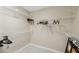 Walk-in closet with metal shelving and wood floors at 9307 Golf View Dr, New Port Richey, FL 34655