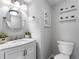 Stylish bathroom featuring a vanity with marble countertop, and decorative shelves with plants at 10356 Carrollwood Ln # 204, Tampa, FL 33618