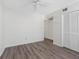 Bright bedroom featuring laminate floors, ceiling fan and closet at 10356 Carrollwood Ln # 204, Tampa, FL 33618