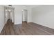 Neutral bedroom with laminate floors, white walls and closet space at 10356 Carrollwood Ln # 204, Tampa, FL 33618
