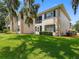 Well-maintained condo with a green lawn, shutters and manicured bushes at 10356 Carrollwood Ln # 204, Tampa, FL 33618