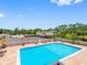 Inviting community pool and tennis courts with ample space for relaxation and recreational activities at 10356 Carrollwood Ln # 204, Tampa, FL 33618
