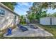 Backyard showing patio, lounge chairs, storage shed and manicured landscape at 10664 Starkey Rd, Seminole, FL 33777