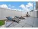 Backyard patio with lounge chairs, table and manicured landscape at 10664 Starkey Rd, Seminole, FL 33777