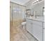 Bright bathroom showcasing a modern vanity, sleek fixtures, and a neutral color palette with ample counter space at 10664 Starkey Rd, Seminole, FL 33777