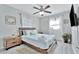 Serene bedroom featuring light wood furniture and soft, blue bedding with abundant natural light at 10664 Starkey Rd, Seminole, FL 33777