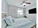 Bright bedroom with sleek decor, large windows, and comfortable bedding at 10664 Starkey Rd, Seminole, FL 33777