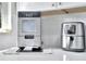 The kitchen countertop has both a modern ice maker and air fryer at 10664 Starkey Rd, Seminole, FL 33777