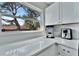 Bright kitchen with quartz countertop, sleek appliances, and natural light at 10664 Starkey Rd, Seminole, FL 33777