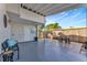 Covered patio with sitting area, offering indoor/outdoor living at 10664 Starkey Rd, Seminole, FL 33777