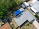 Aerial view showing roof, yard, patio, fence line, and surrounding neighborhood at 10912 N 61St St, Temple Terrace, FL 33617
