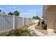 Long white fence and stone path highlighting the property's backyard at 10912 N 61St St, Temple Terrace, FL 33617