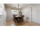 Dining room featuring hardwood-style floors and a wood table with matching chairs at 10912 N 61St St, Temple Terrace, FL 33617