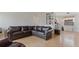 Inviting living room with hardwood floors, a comfortable brown leather sofa, and built-in shelving at 10912 N 61St St, Temple Terrace, FL 33617