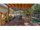 Inviting patio featuring brick flooring, a pergola, and a tranquil outdoor setting at 10912 N 61St St, Temple Terrace, FL 33617