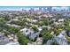 This is an aerial view of a residential neighborhood with downtown skyscrapers as a backdrop at 1211 W Horatio St # A, Tampa, FL 33606