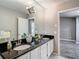 Bathroom featuring double sinks with granite countertops, and ample counter space at 1211 W Horatio St # A, Tampa, FL 33606