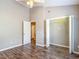 Bright bedroom features wood-look flooring, neutral paint, and a window at 1211 W Horatio St # A, Tampa, FL 33606