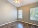Bedroom with hardwood flooring, ceiling fan and lots of natural light at 1211 W Horatio St # A, Tampa, FL 33606