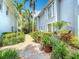 Beautiful courtyard with lush greenery, brick pathway, and charming landscaping at 1211 W Horatio St # A, Tampa, FL 33606