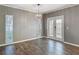 Dining room featuring wood floors, chandelier and natural light at 1211 W Horatio St # A, Tampa, FL 33606