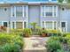 Charming townhome exterior with well-maintained landscaping and inviting curb appeal at 1211 W Horatio St # A, Tampa, FL 33606