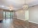 Living room with ceiling fan, chandelier and natural light from bright windows at 1211 W Horatio St # A, Tampa, FL 33606
